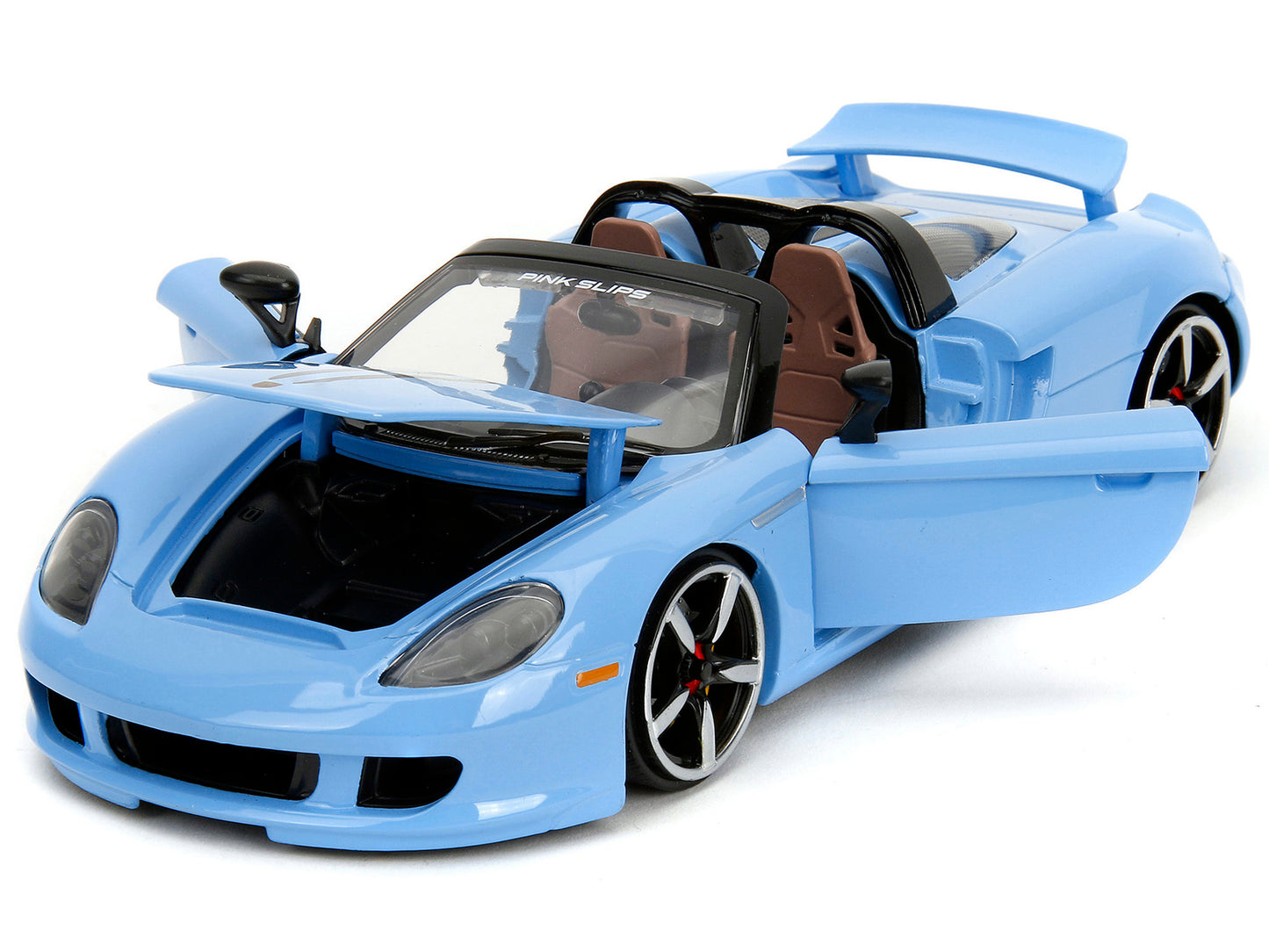 Blue Porsche Carrera GT convertible diecast model car with black stripes from Jada's Pink Slips series, 1/24 scale.