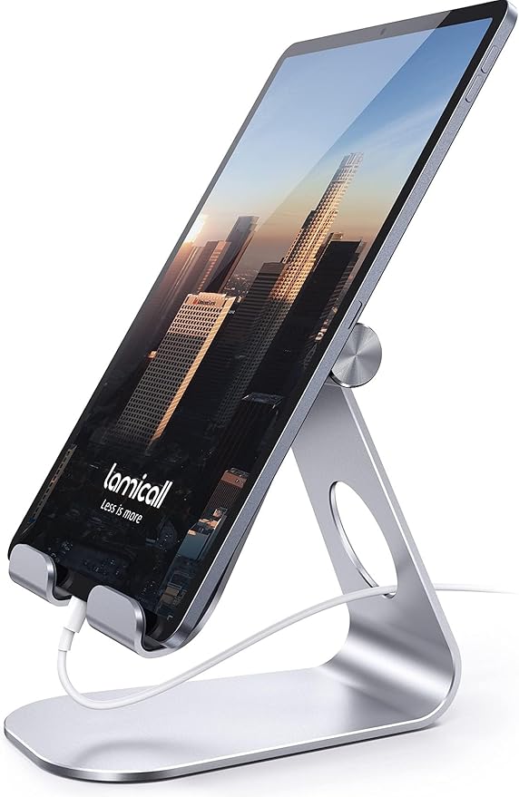 American Smart Lamicall adjustable tablet stand holding a silver iPad Pro and Kindle on a desktop workspace.