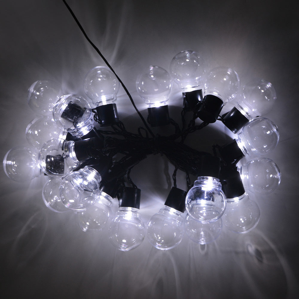 American Smart EP LED outdoor waterproof solar light string with retro hook bulbs illuminating garden and lawn areas.