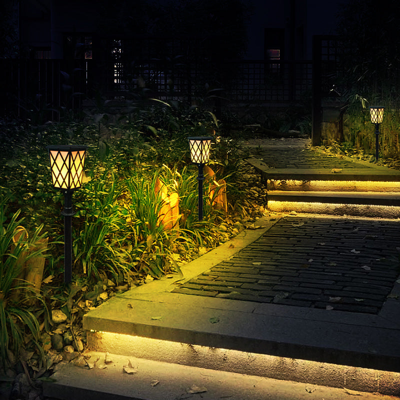 Eprolo solar LED flame light outdoor garden wall lamp illuminating villa lawn with a warm, flickering flame design.