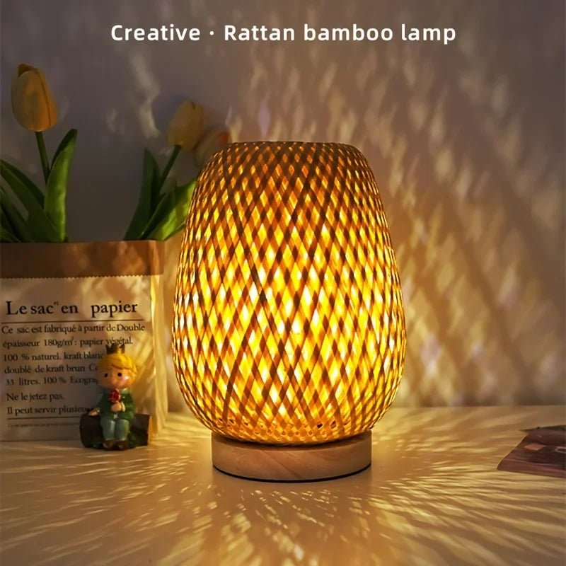 Handmade retro Japanese style bamboo and rattan LED desk lamp with wooden house design, provides warm ambient lighting.