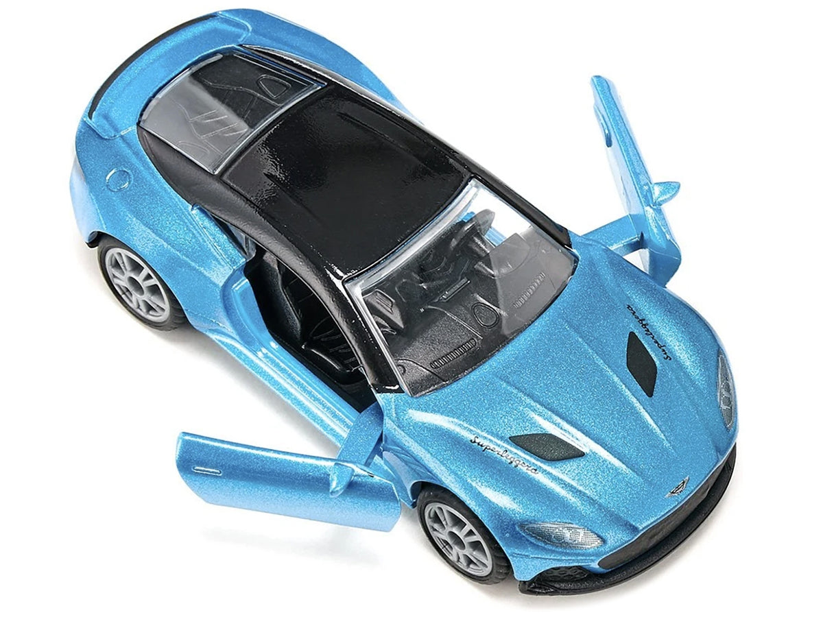 Blue metallic Aston Martin DBS Superleggera diecast model car by SIKU with black top, detailed miniature Aston Martin model.