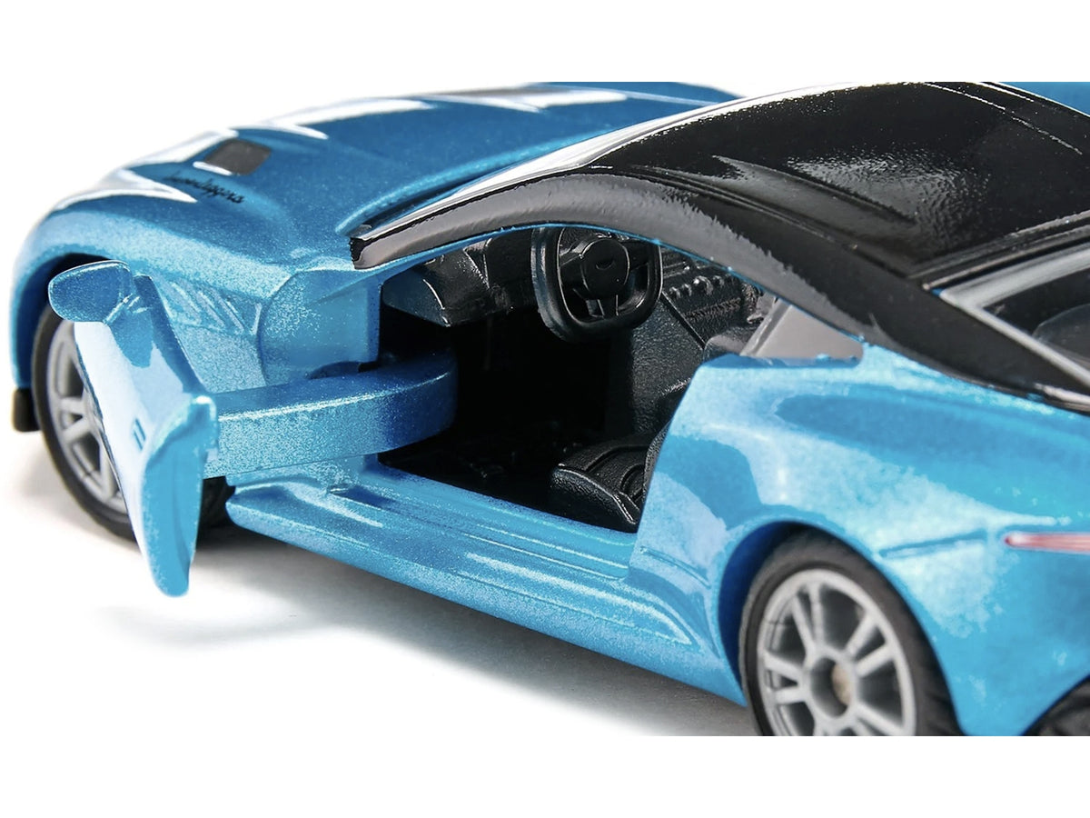 Blue metallic Aston Martin DBS Superleggera diecast model car with black roof by SIKU, detailed miniature of luxury sports car.
