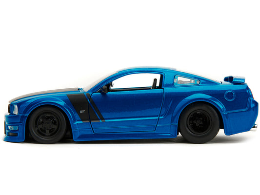 2006 Ford Mustang GT diecast model car by Jada, blue metallic with matte black hood and stripes, Bigtime Muscle Series, 1/24 scale