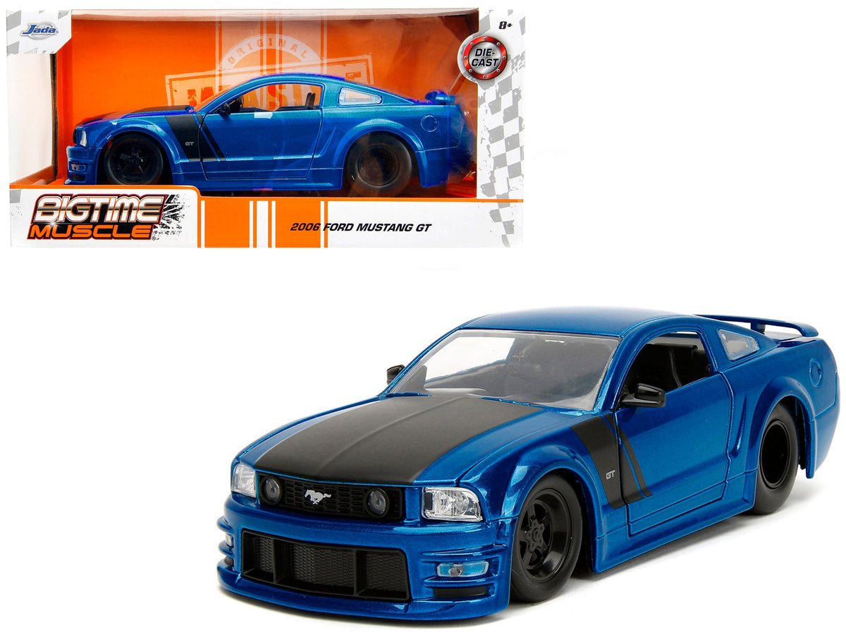 2006 Ford Mustang GT diecast model car by Jada, blue metallic with matte black hood and stripes, part of Bigtime Muscle Series.