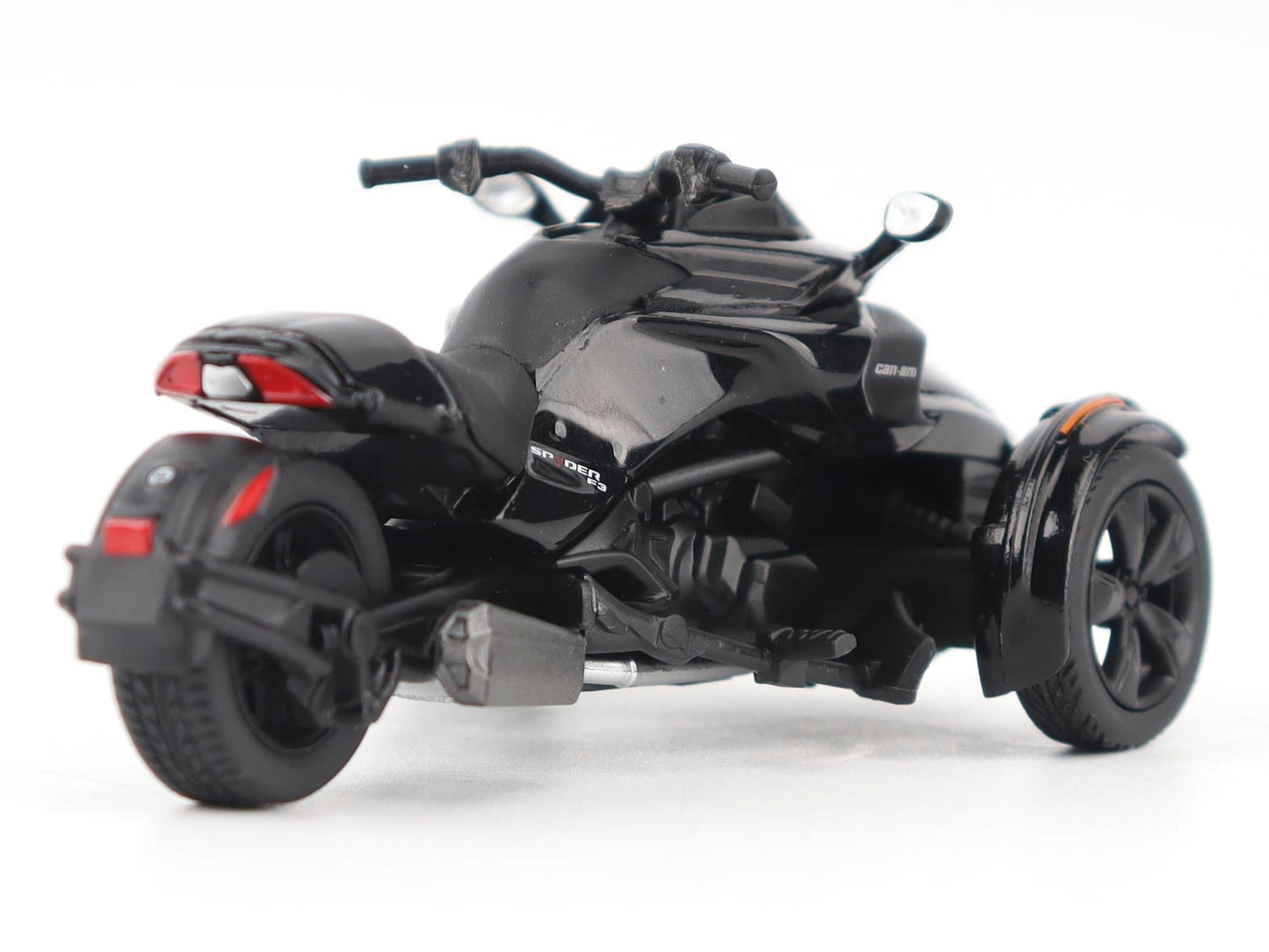 Black metallic Can-Am Spyder F3 3-wheel motorcycle diecast model by BRP Models, detailed and realistic in 1/32 scale.