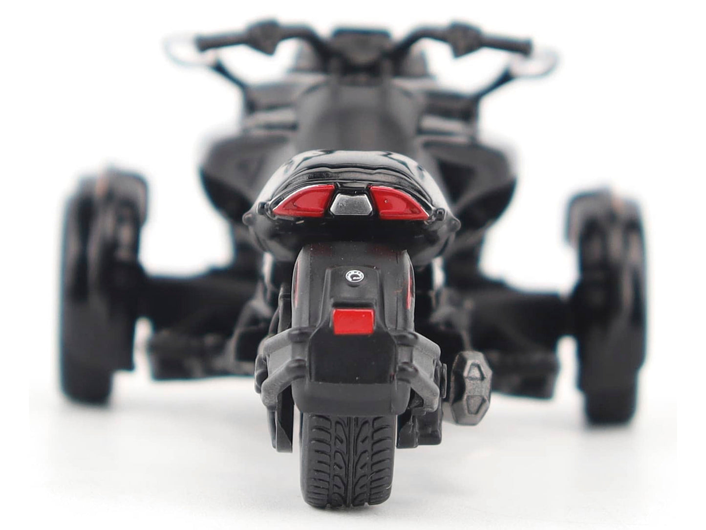 Black metallic Can-Am Spyder F3 3-wheel motorcycle diecast model by BRP Models, detailed scale replica, front and side view.