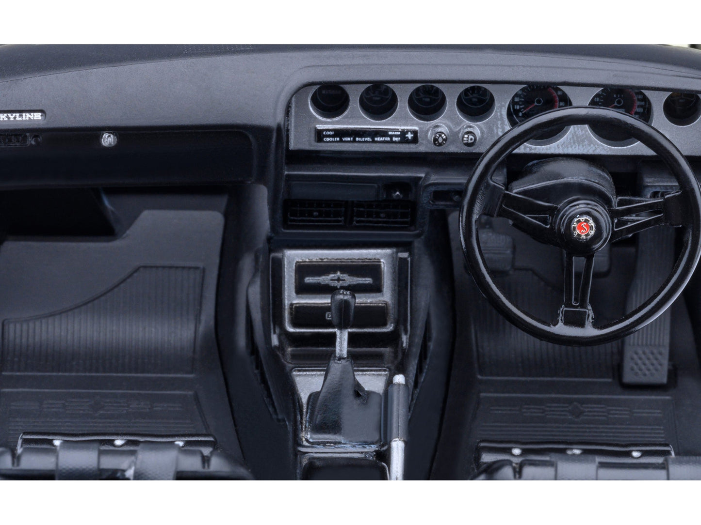 White Nissan Skyline 2000GT-R (KPGC110) tuned model car in 1/18 scale by Autoart, showing detailed exterior and right-hand drive layout.