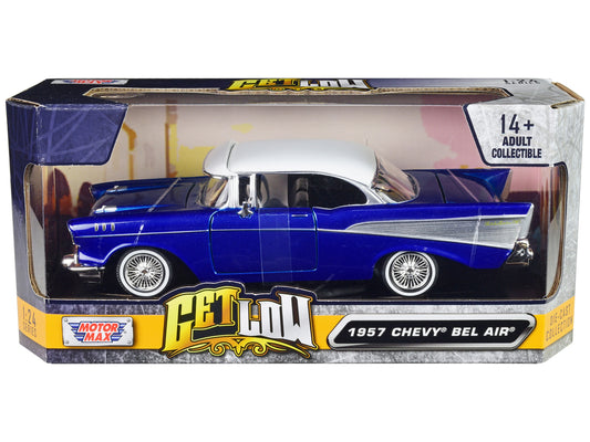 1957 Chevrolet Bel Air Lowrider diecast model car in candy blue with white top by Motormax, detailed 1/24 scale collectible.