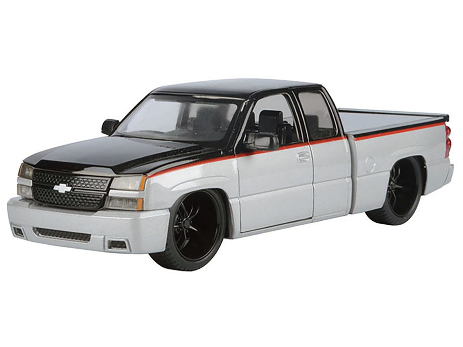 Silver metallic and black 2006 Chevrolet Silverado die-cast model truck with red stripes by Motormax, part of the Die-Cast Collection series.