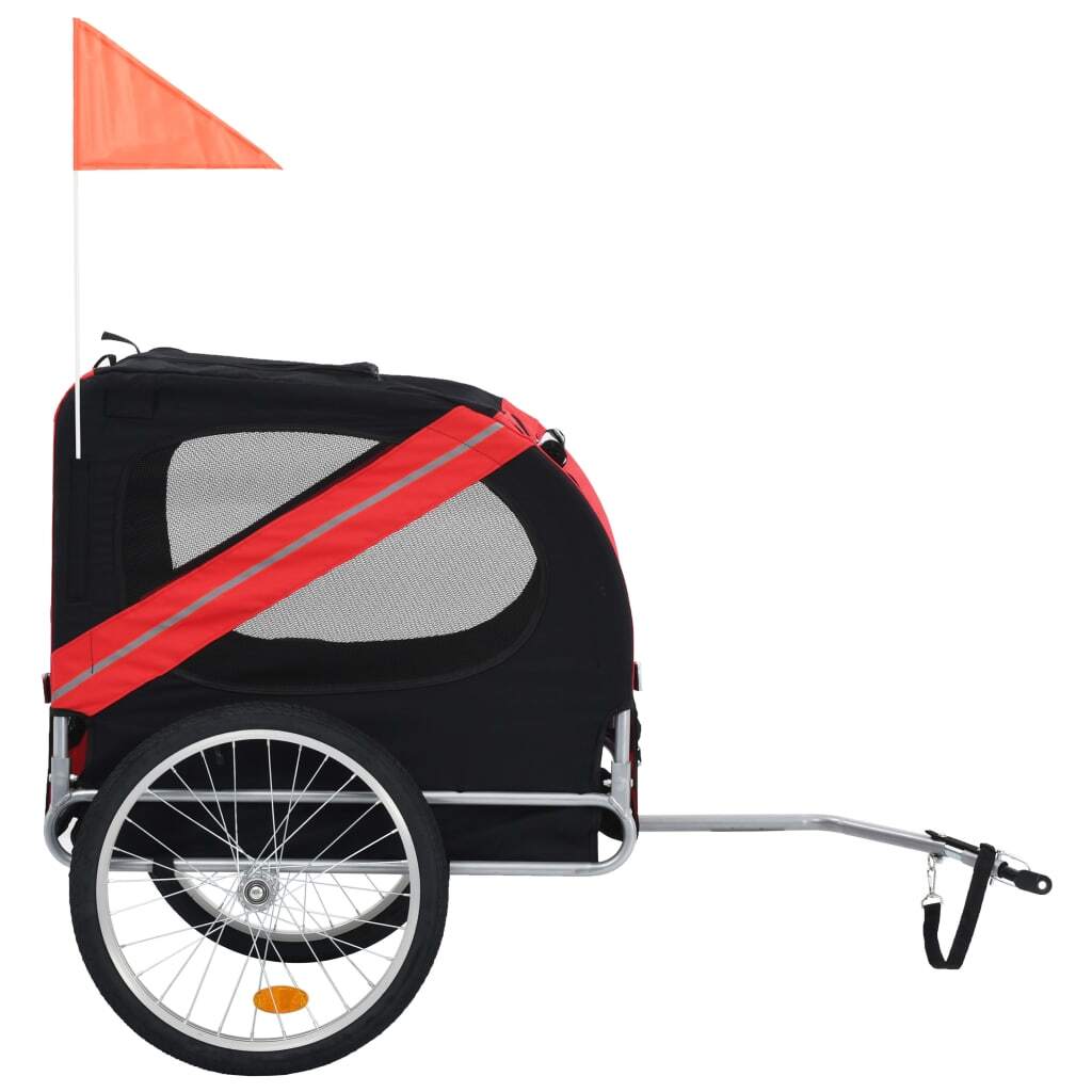 Red and black American Smart pet bike trailer attached to a bicycle, designed for transporting pets safely during rides.