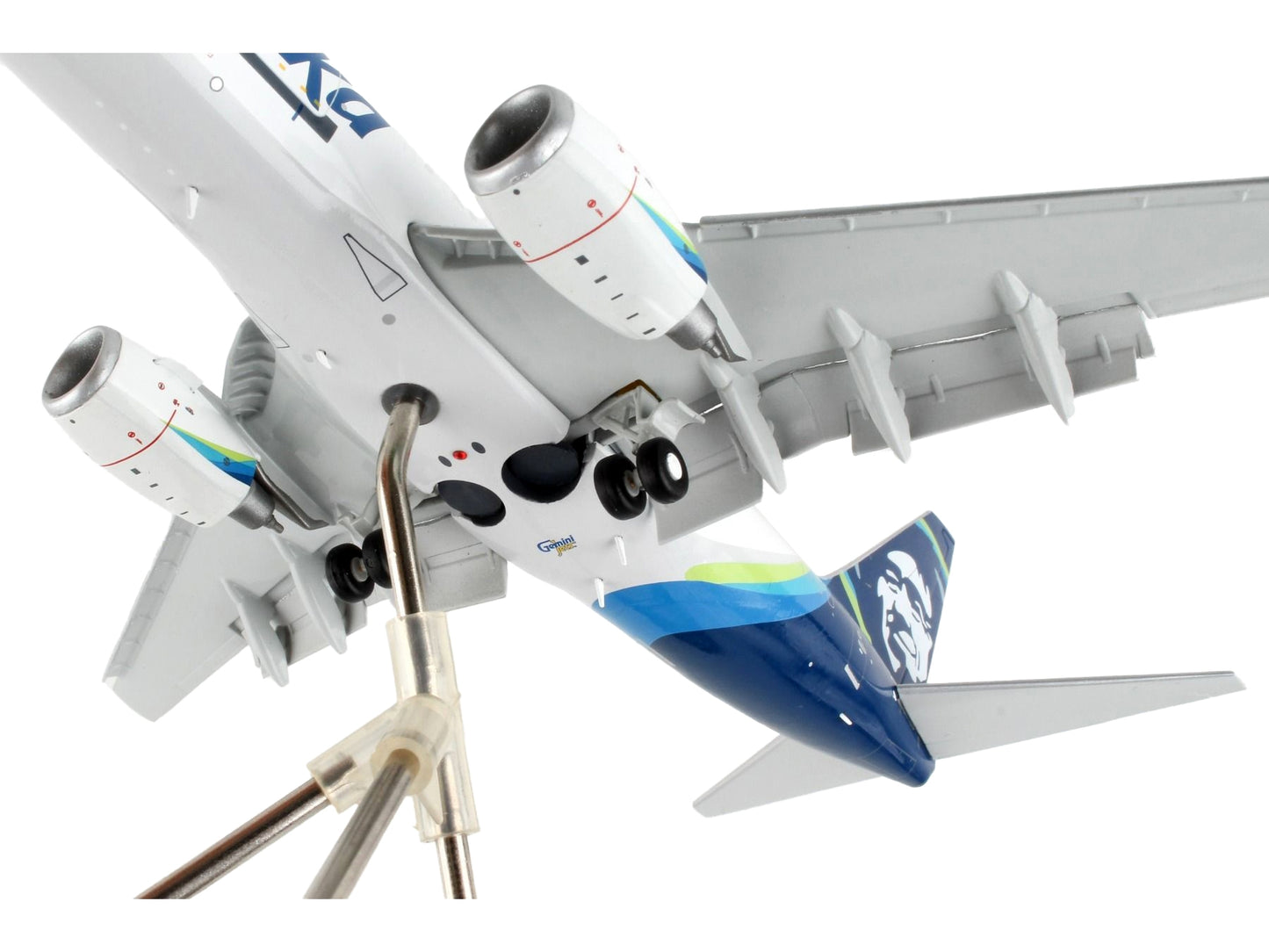 GeminiJets Boeing 737-700BDSF Alaska Air Cargo diecast model airplane with blue tail, flaps down, in white with blue accents.