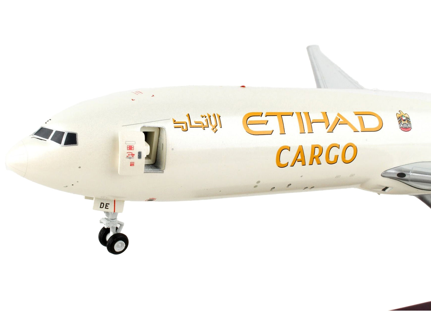 Boeing 777F cargo aircraft diecast model by GeminiJets with beige color and tail graphics, part of Gemini 200 series.