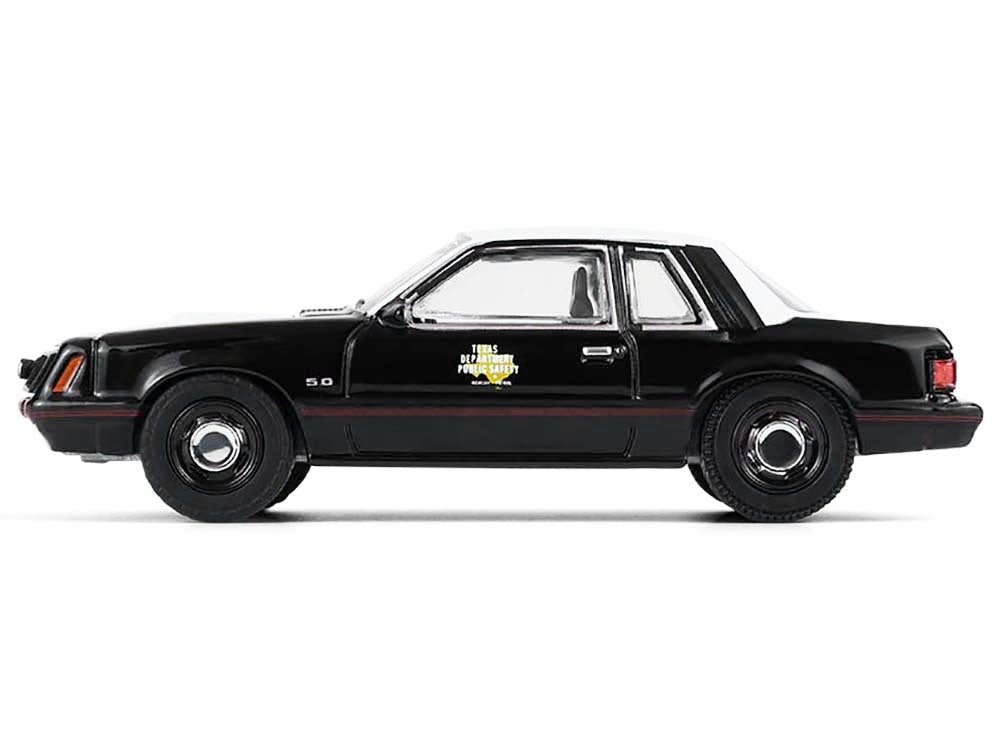 Black 1982 Ford Mustang SSP diecast model car by Greenlight, with white hood and top, part of the Hobby Exclusive Series 1/64.