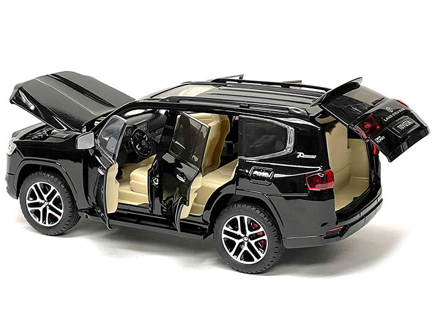Black metallic Toyota Land Cruiser 1/24 diecast model car, detailed miniature vehicle from Toyota models collection.