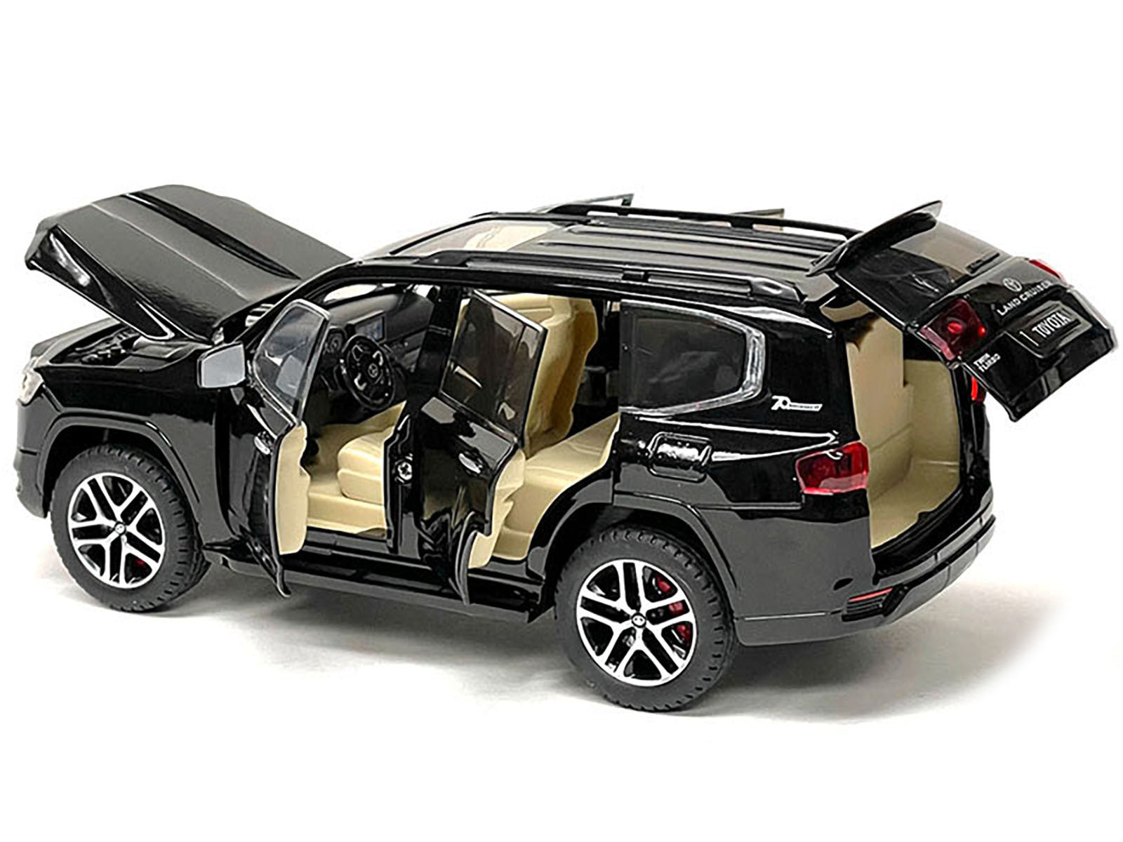 Black metallic Toyota Land Cruiser 1/24 diecast model car, detailed miniature vehicle from Toyota models collection.