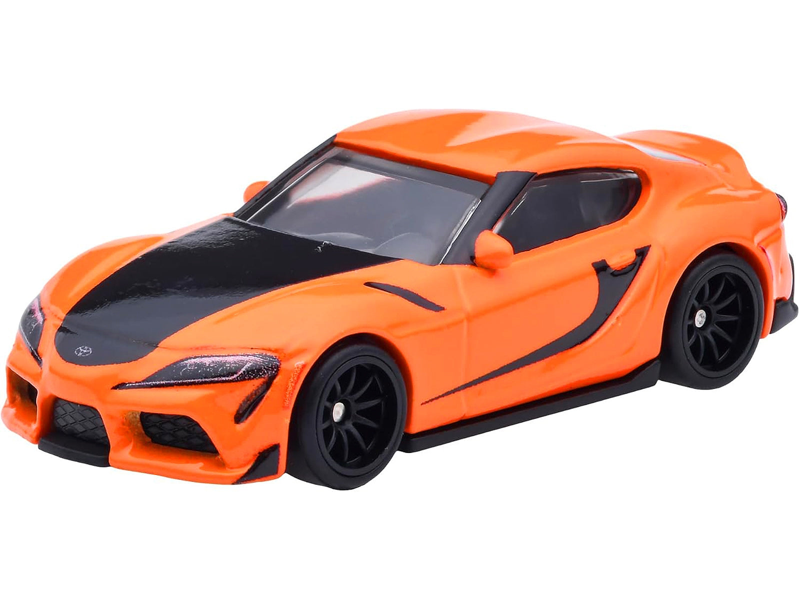 Orange and black 2021 Toyota GR Supra diecast model car from Hot Wheels, inspired by Fast & Furious series, detailed toy vehicle.