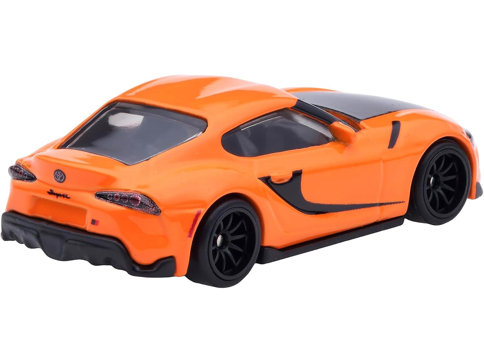 Orange and black 2021 Toyota GR Supra diecast model car from Hot Wheels, inspired by the Fast & Furious F9 movie series.