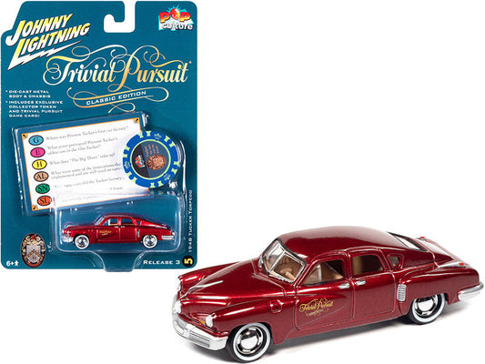 1948 Tucker Torpedo Red Maroon Metallic "Tucker: The Man and His Dream" (1988) Movie with Poker Chip (Collector Token) and Game Card "Trivial Pursuit" "Pop Culture" Series 3 1/64 Diecast Model Car by Johnny Lightning-0