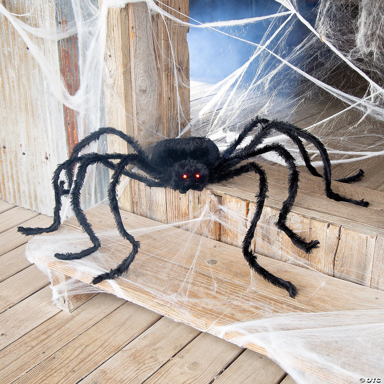 Black spider-shaped cardstock from American Smart featuring light-up long black hair for scrapbooking and craft projects.