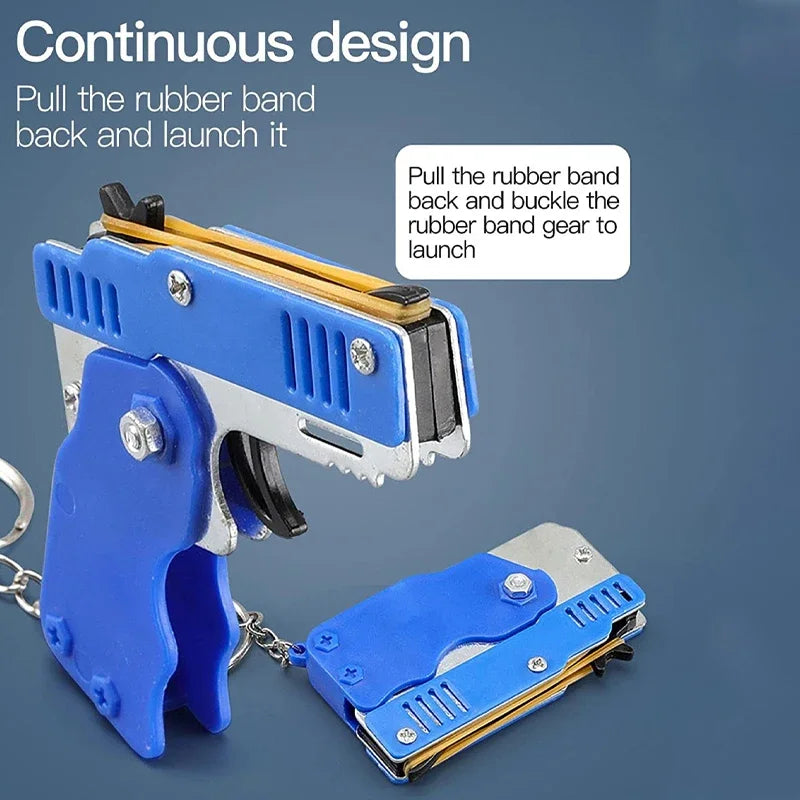 1x Mini Keychain Gun Rubber Band Toy Shooting Pistol Alloy Kid Outdoor Activities Party Game Birthday Gift for Children Creative