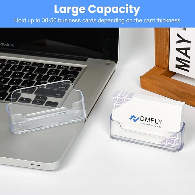 Two clear plastic business card holders on a desk, ideal for displaying business cards at office or exhibition booths.