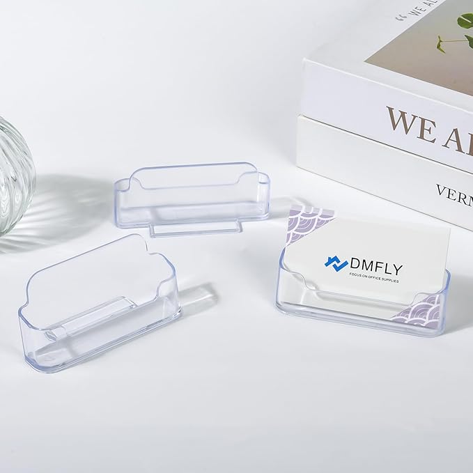 Two clear plastic business card holders on a desk, acrylic display stands for office or exhibition use, by American Smart.