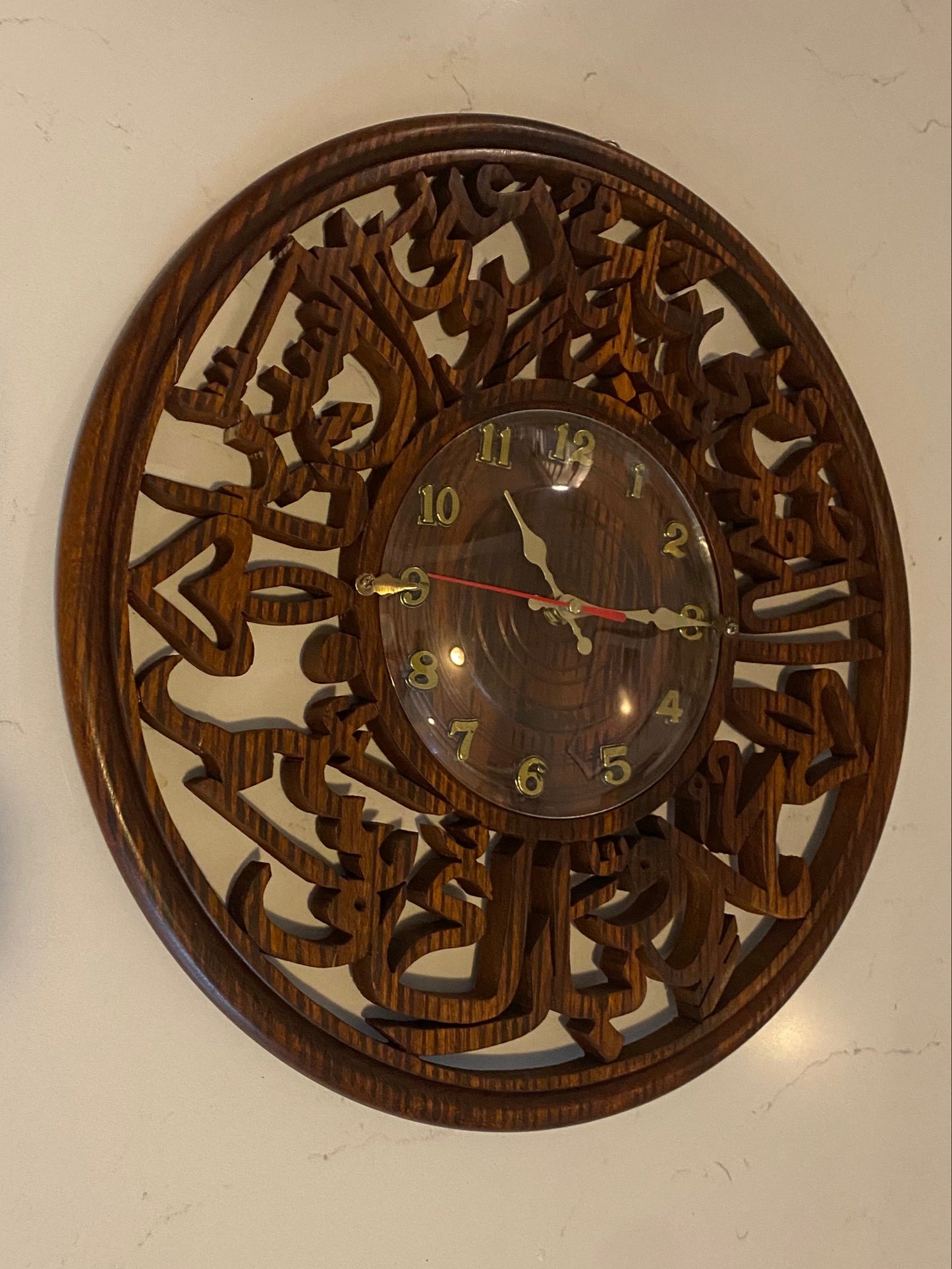 Vintage Islamic wooden wall clock by American Smart with traditional carved design and Arabic numerals.