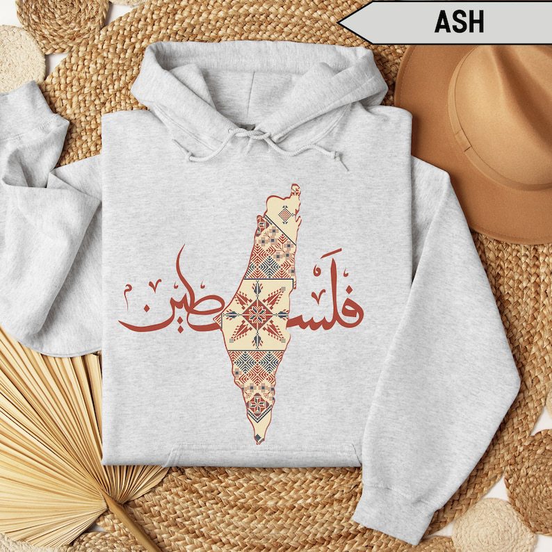 Traditional Palestinian hoodie by American Smart EP featuring Arabic design, comfortable fabric, and cultural embroidery details.