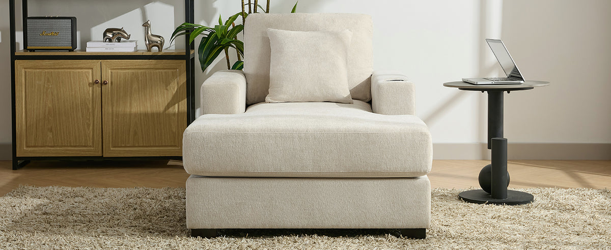 Cream oversized chaise lounge sofa by American Smart with pillows, charge station, cup holders, and chenille fabric.