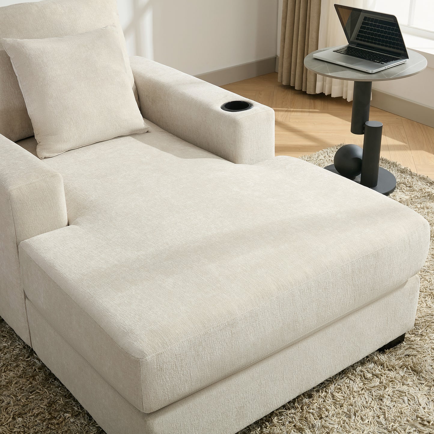 Cream oversized chaise lounge sofa in modern style with pillows, cup holders, charge station, and chenille fabric.