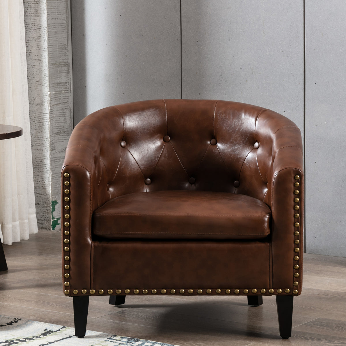 American Smart PU leather tufted barrel chair with a rounded design, suitable for living rooms, bedrooms, or club spaces.