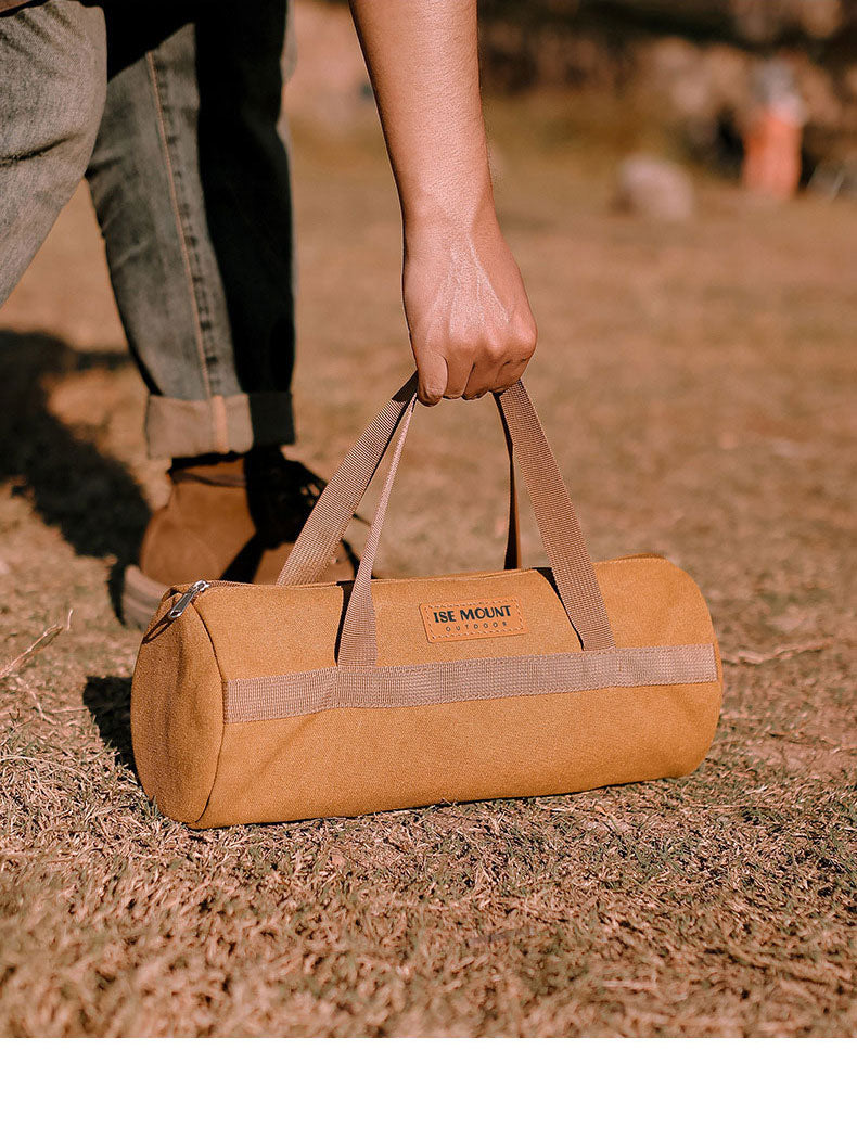 American Smart outdoor camping accessories storage bag with tent wind rope nail tool compartments, portable cylindrical design.