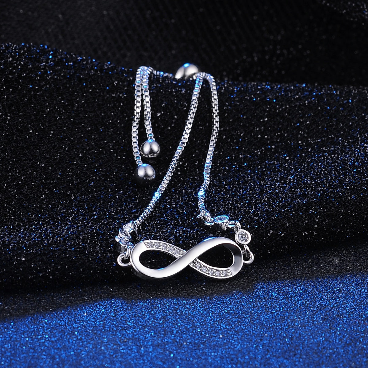 Sparkling rhinestone infinity bracelet by American Smart EP, featuring diamond-like stones for men and women jewelry.