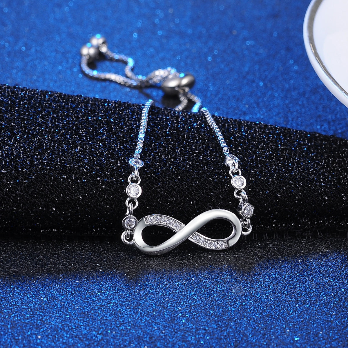 Elegant rhinestone infinity bracelet by American Smart, featuring sparkling diamantes for men's and women's jewelry.