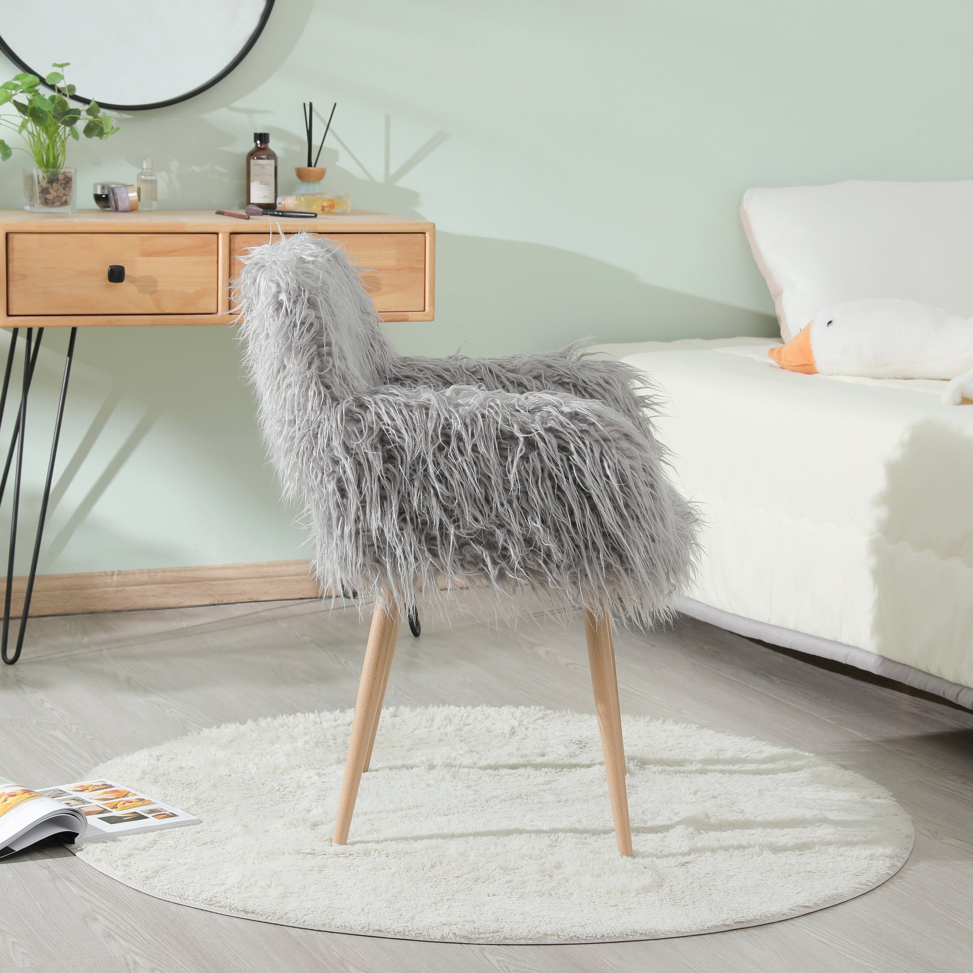 Grey faux fur upholstered makeup and side dining chair with beech metal legs, stylish and comfortable for modern interiors.