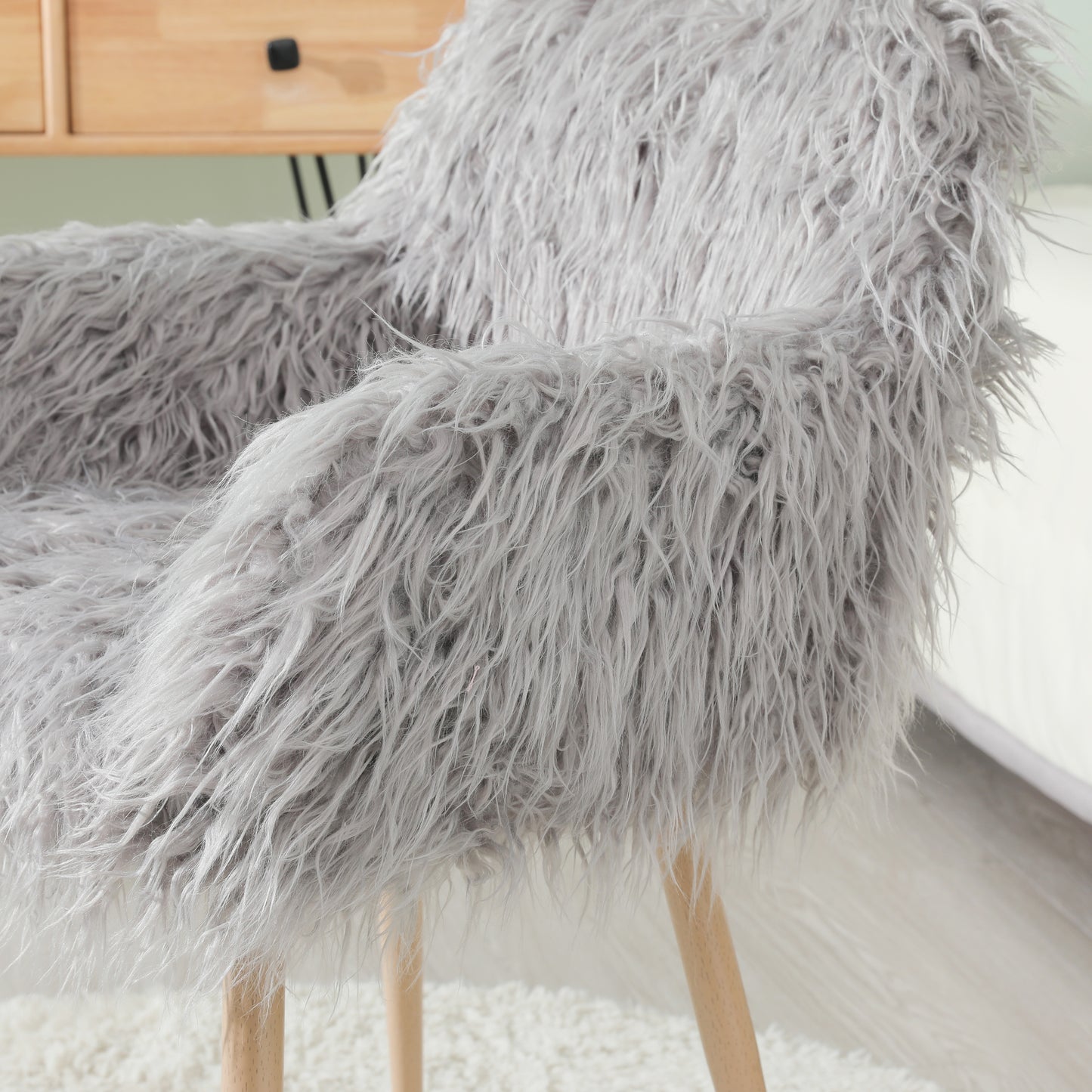 Grey faux fur upholstered makeup and side dining chair with beech metal legs, modern and comfortable for living spaces.