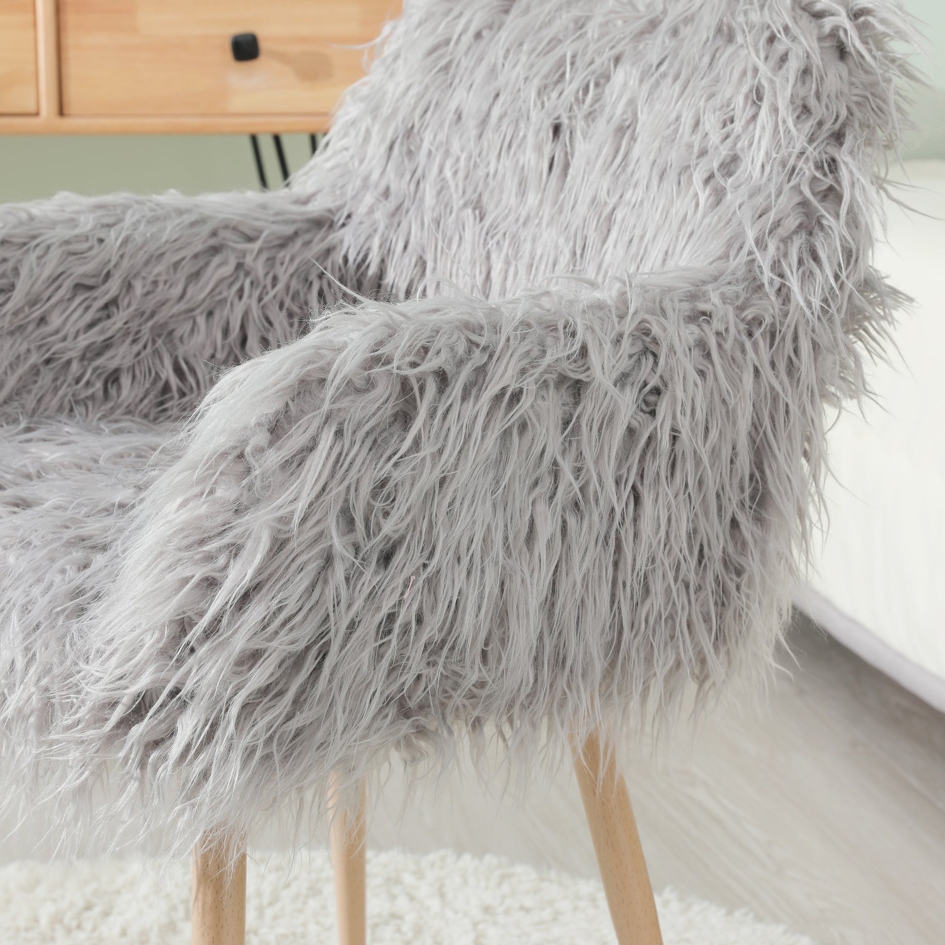 Grey faux fur upholstered makeup and side dining chair with beech metal legs, modern and comfortable for living spaces.