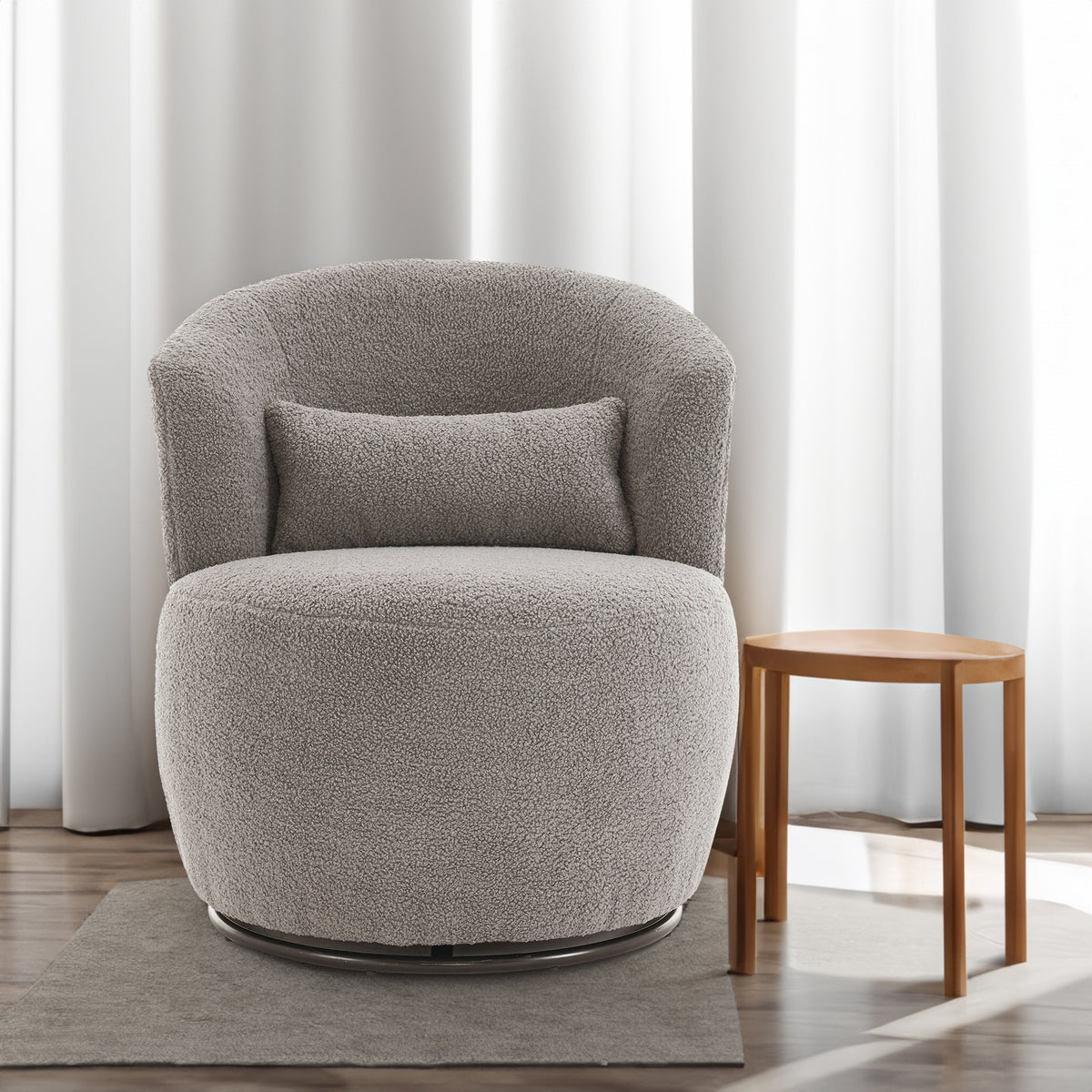 Grey plush swivel accent chair with round arms and metal base, 360° rotation, modern design for living room comfort and style.