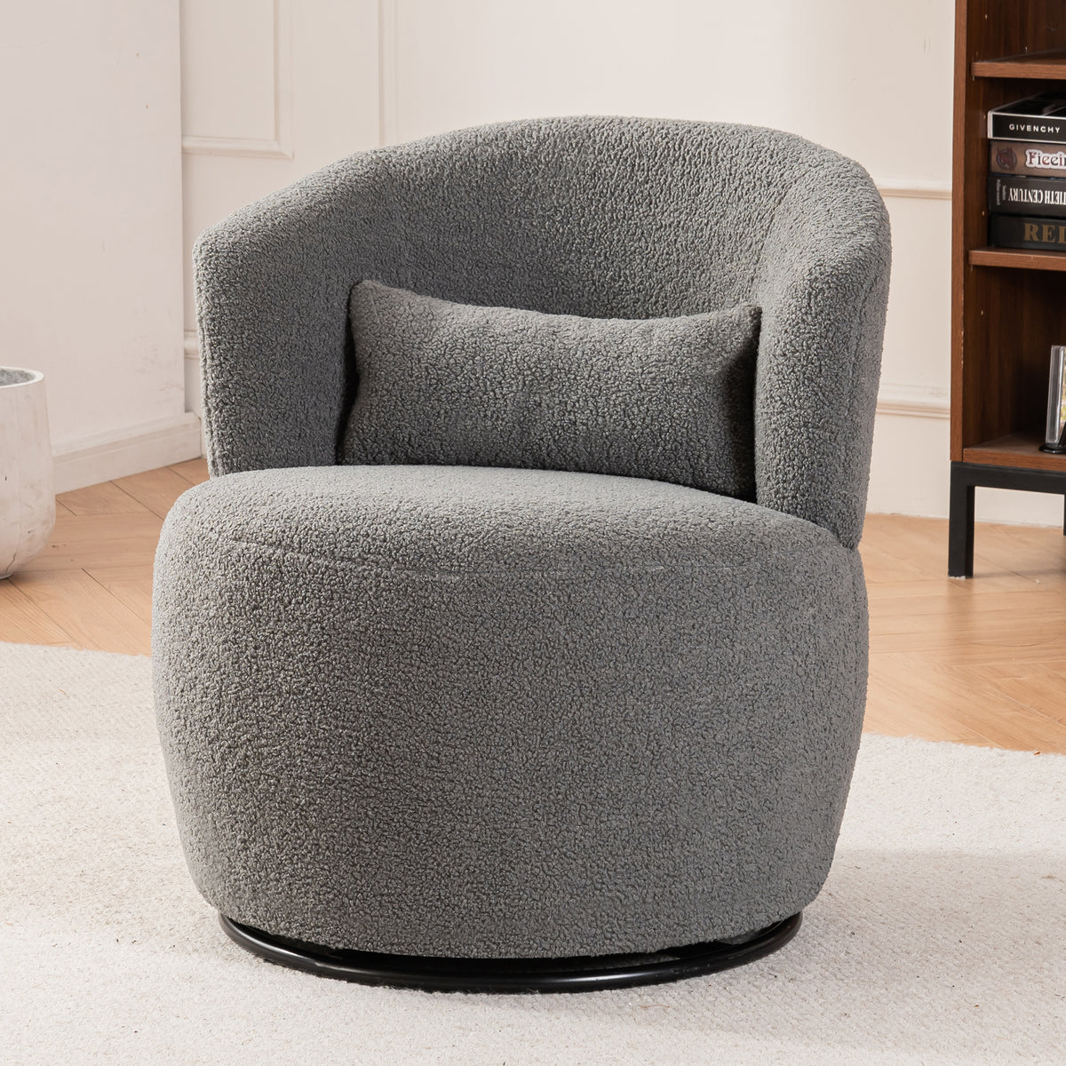 Grey plush swivel accent chair with round arms and metal base, perfect for contemporary living room decor.