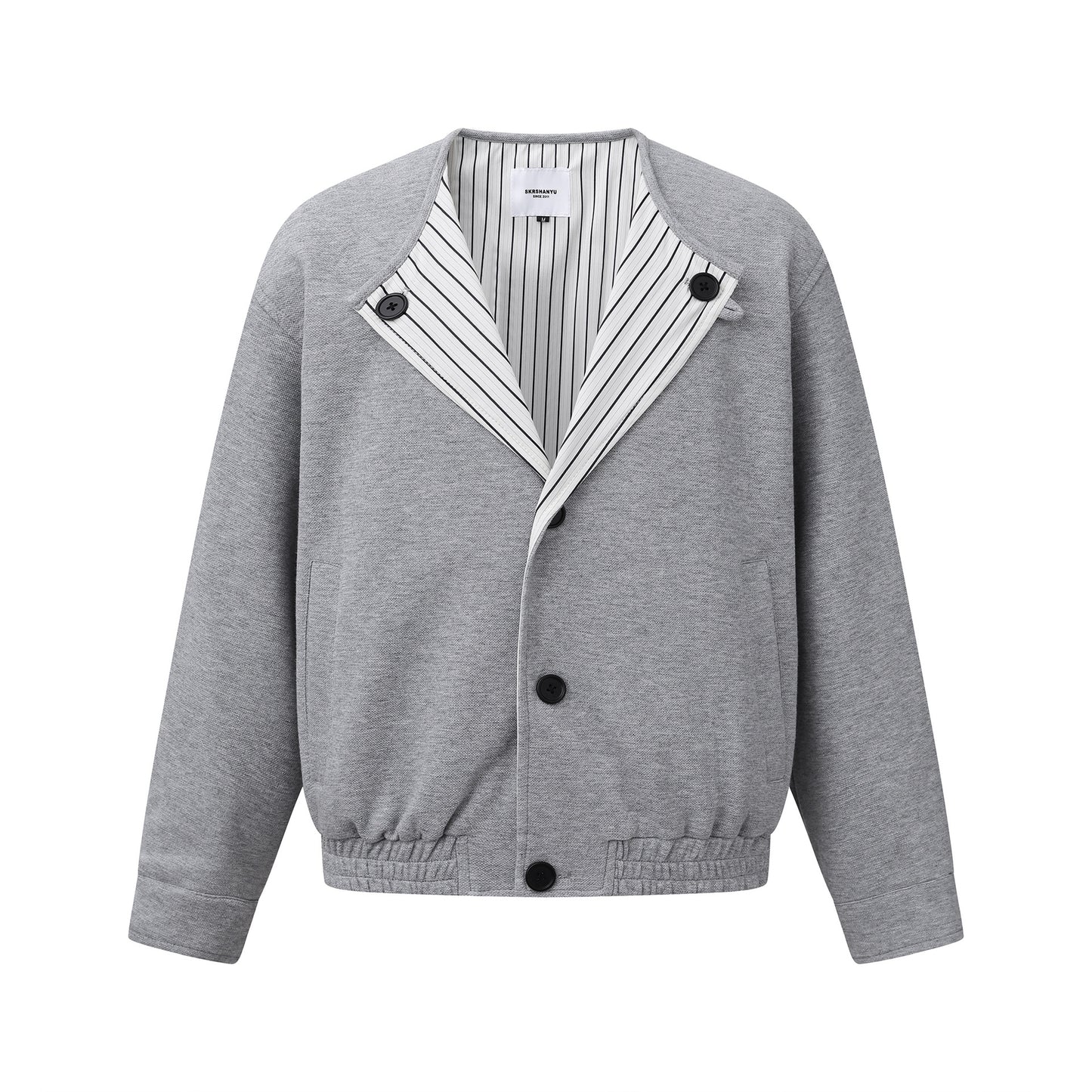 Oversized American Smart shoulder jacket with long sleeves and no collar, stylish loose-fit coat for outdoor wear.