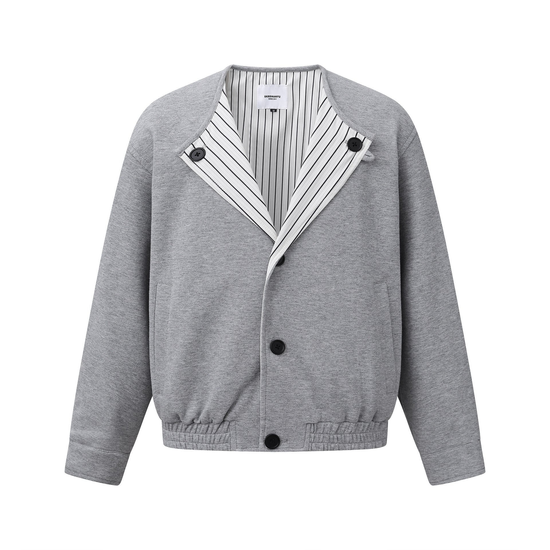 Oversized American Smart shoulder jacket with long sleeves and no collar, stylish loose-fit coat for outdoor wear.