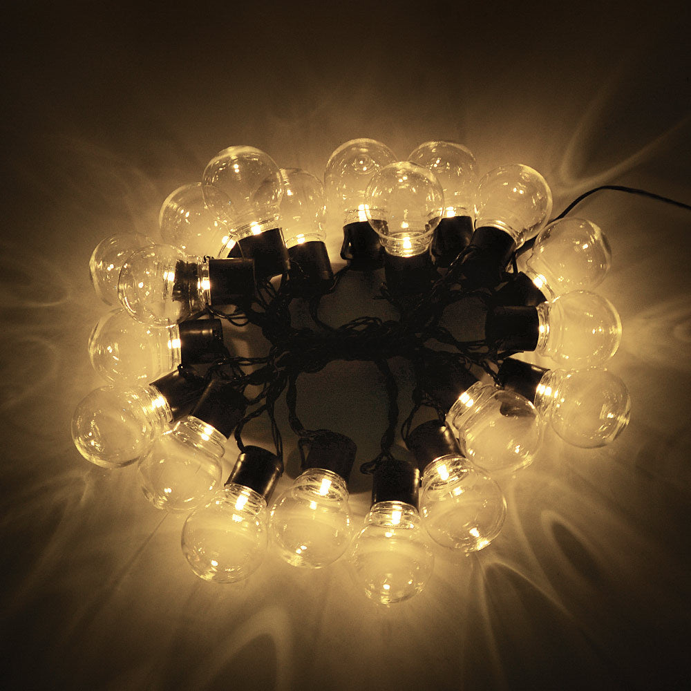 American Smart EP LED outdoor waterproof solar string lights with retro hook bulbs illuminating garden lawn area.