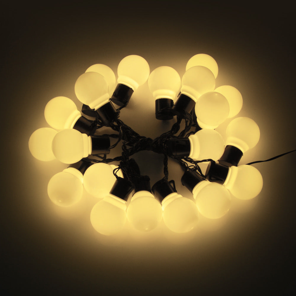 American Smart LED outdoor waterproof solar string lights with retro hook bulbs illuminating garden and lawn areas.