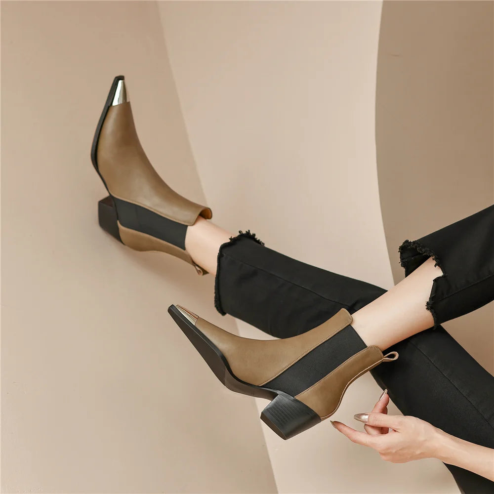 Genuine leather women ankle boots with thick heels, metal decoration, splicing design, suitable for autumn winter office wear.