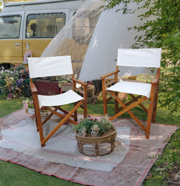 Pair of American Smart wooden director folding chairs with white canvas seats, lightweight and portable for indoor and outdoor use.