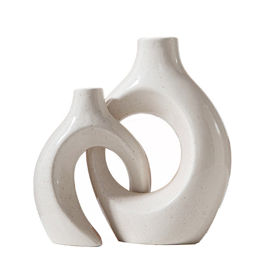 Abstract ceramic candle holder and vase featuring a Nordic-inspired irregular circle design, ideal for living room or hotel decor.