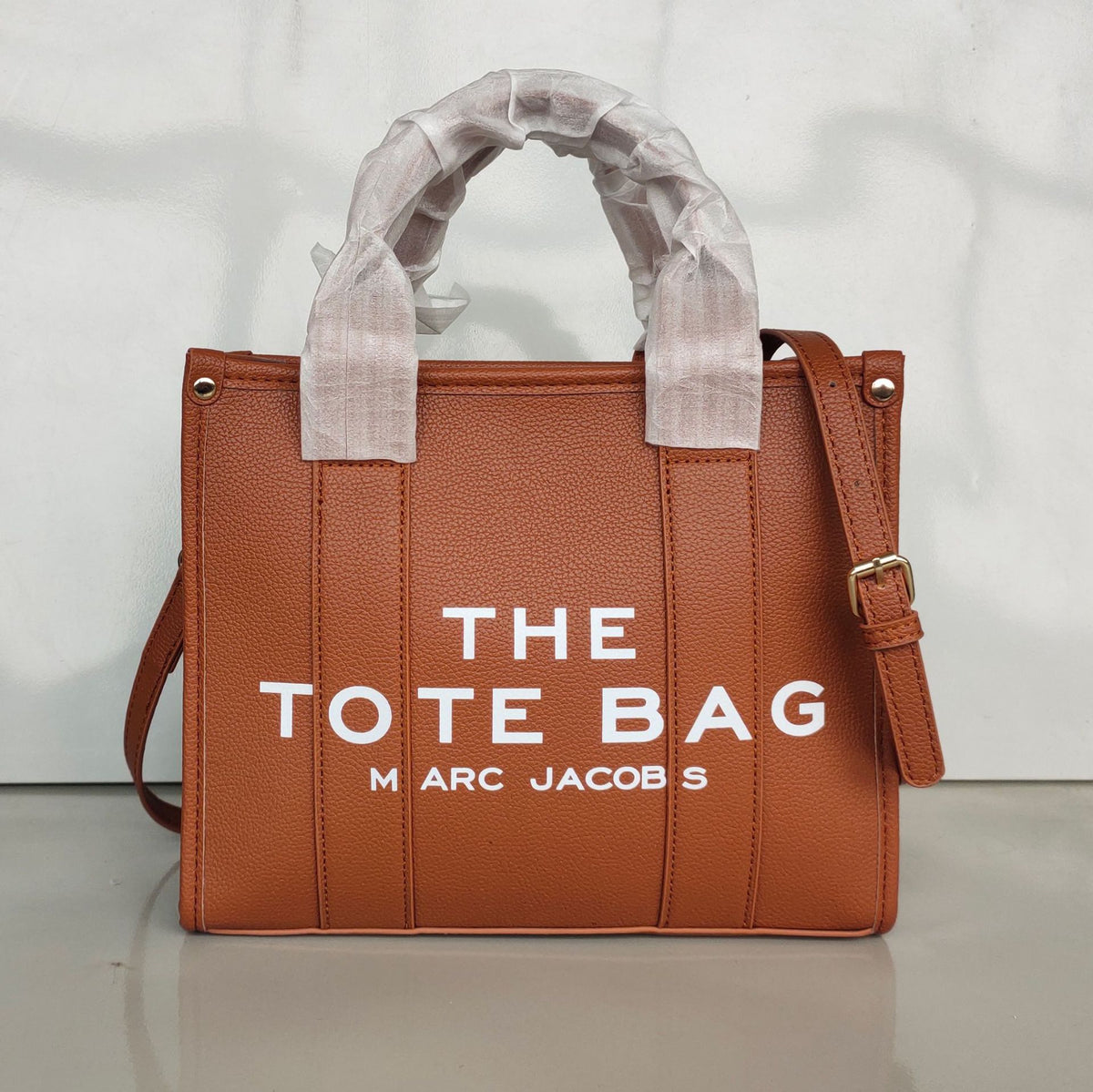 Small women's trendy tote bag by American Smart, stylish crossbody and shoulder bag in black with minimalist design.