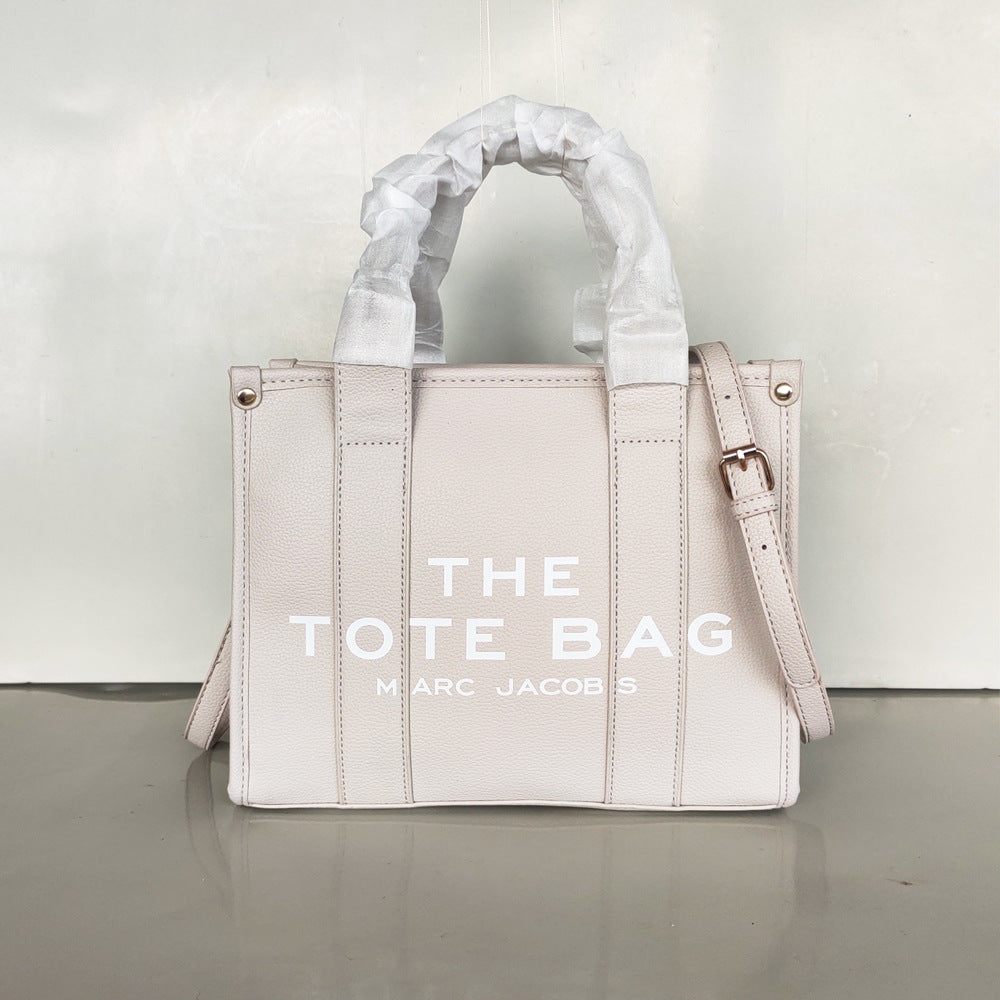 Small women's trendy tote bag by American Smart featuring a stylish crossbody design and single shoulder strap.