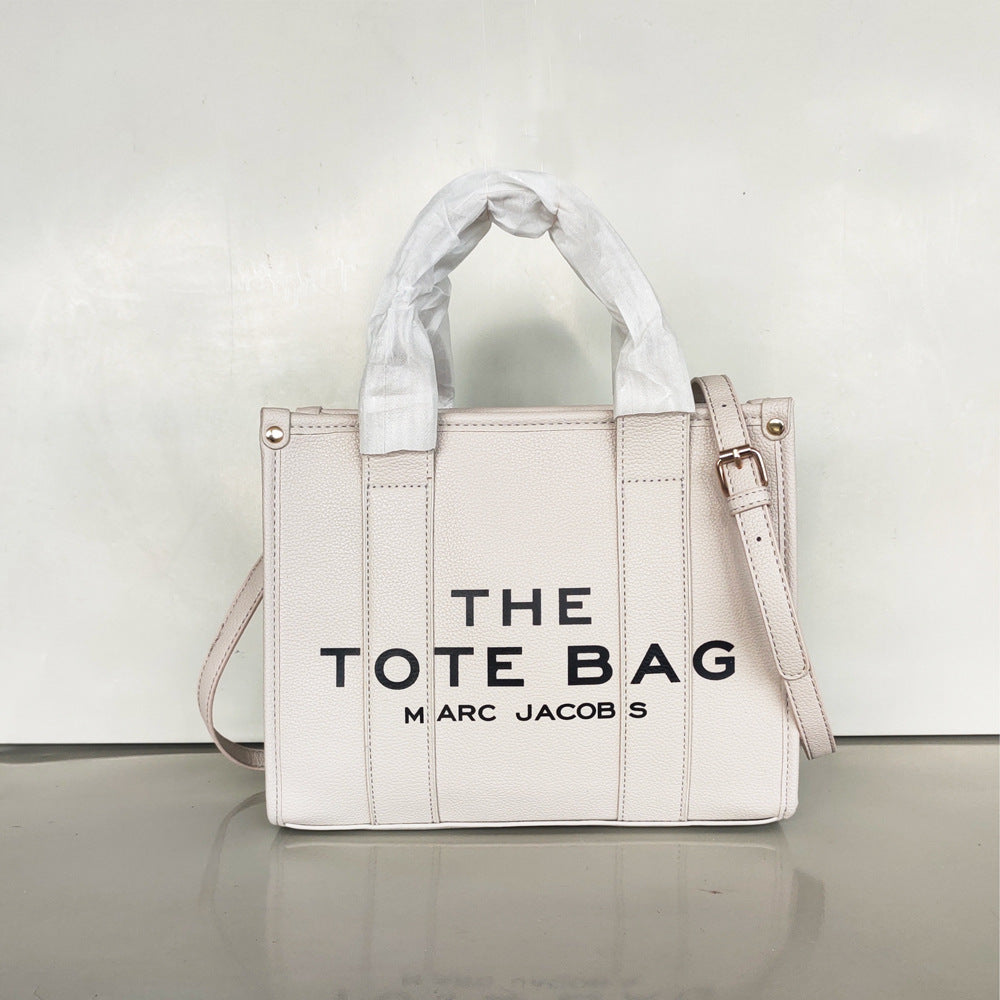 Small women's fashion tote bag by American Smart, trendy crossbody and shoulder bag with a sleek design.